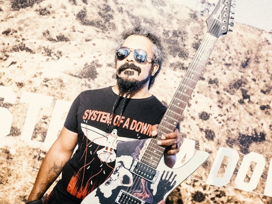 System Of A Down fan with a guitar at the pop-up
