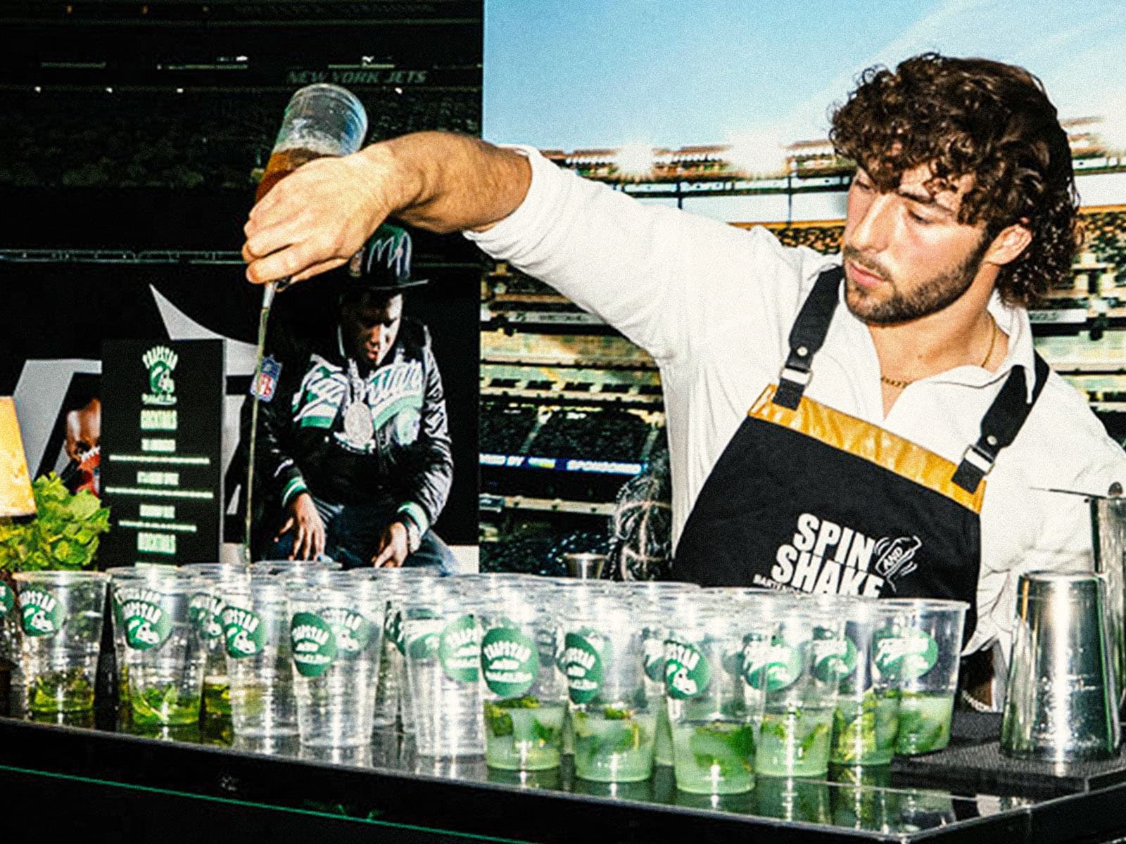 Bartender preparing drinks at a hospitality bar