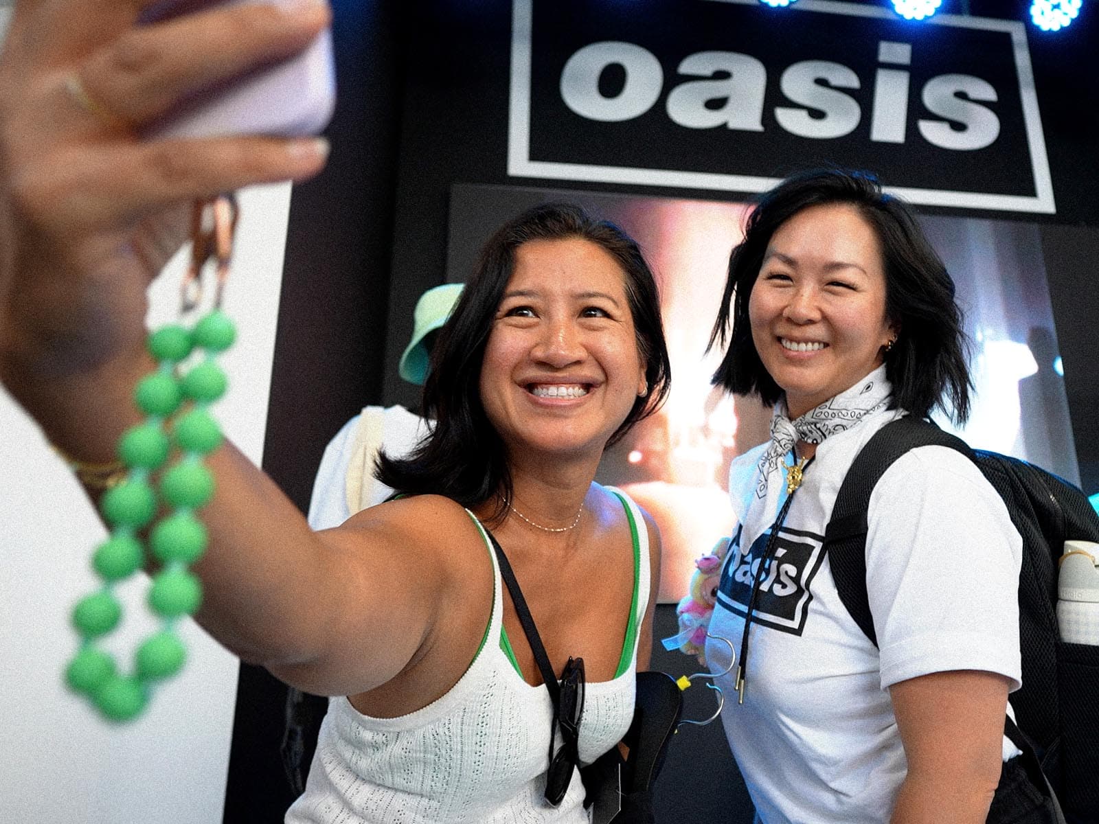 Fans taking a selfie at the Oasis world tour store