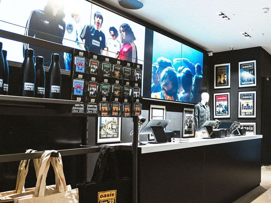 Interior of a tour merchandise store with product wall and till point